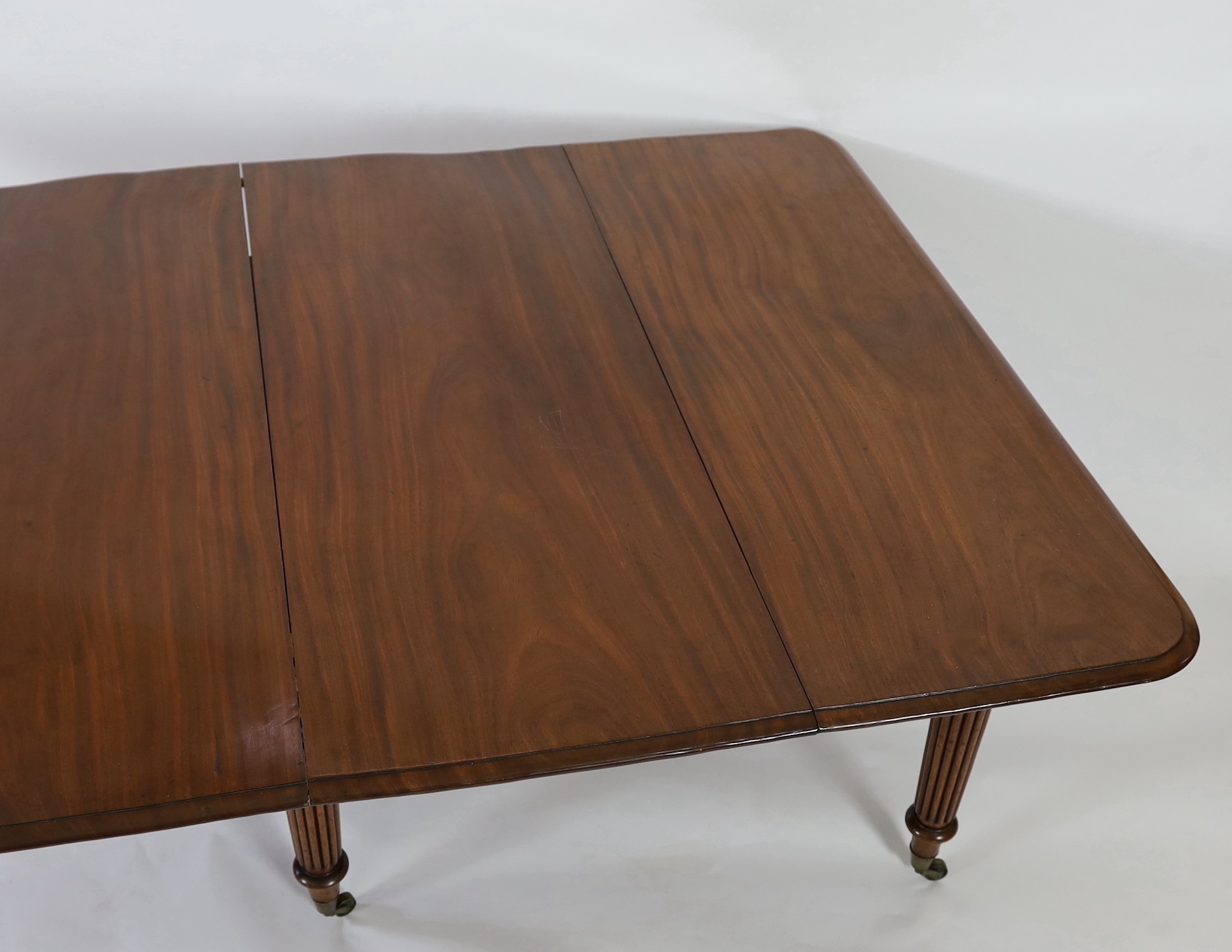A Regency mahogany extending dining table